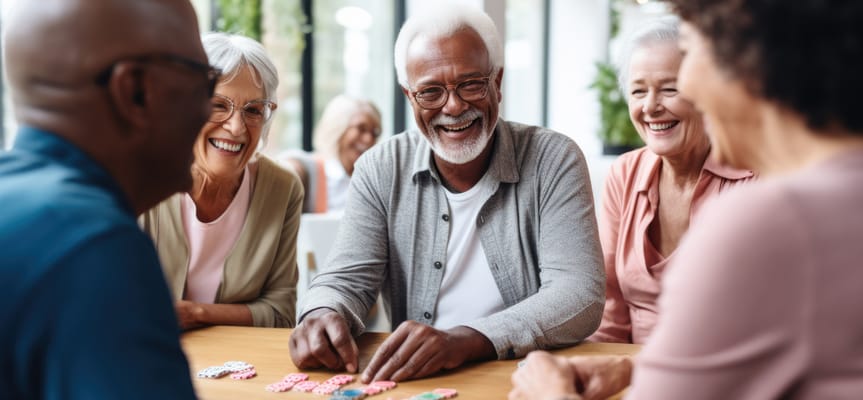 Residents enjoying a game around a table