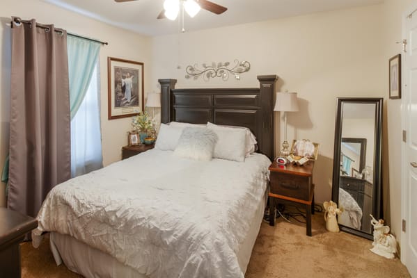 A cozy bedroom with a bed and decorative items