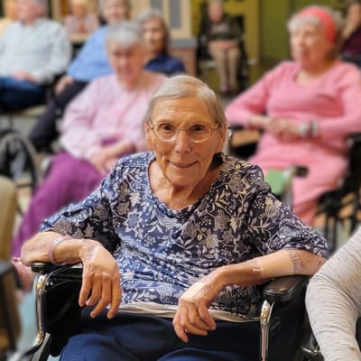 Resident smiling in a common area