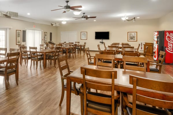 Bright dining area with wooden tables and chairs