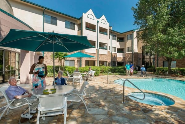 Residents enjoying time by the poolside