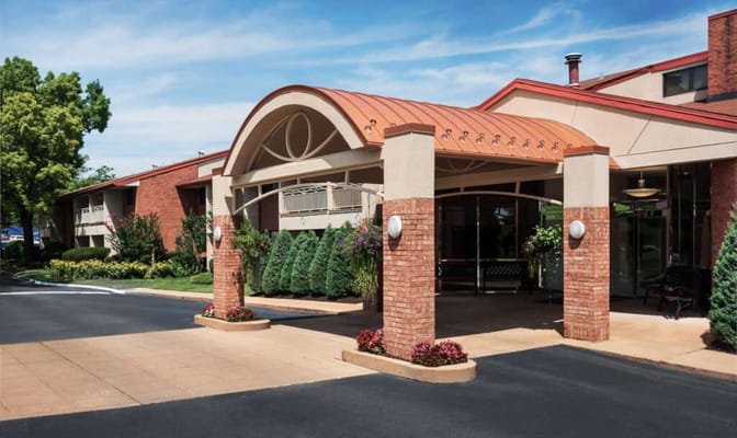 Entrance canopy of the facility with landscaped gardens