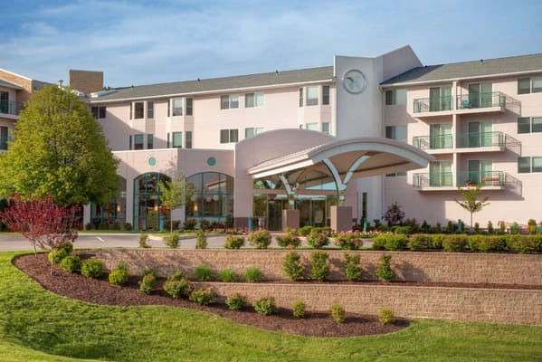 Exterior view of Delmar Gardens with landscaped garden