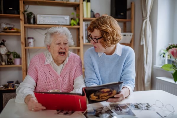 Residents enjoying a moment together, looking through photos
