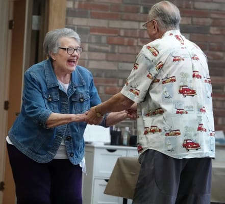 Residents dancing and enjoying a celebration