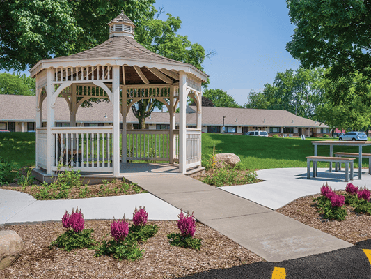 Gazebo surrounded by landscaped gardens and pathways