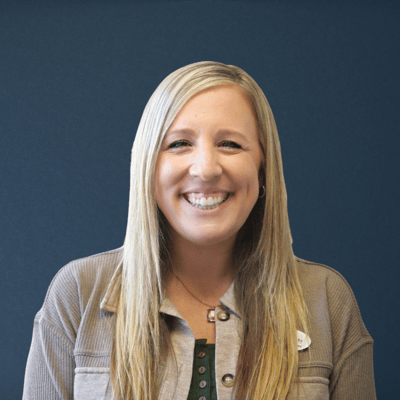 Staff member smiling in a professional setting