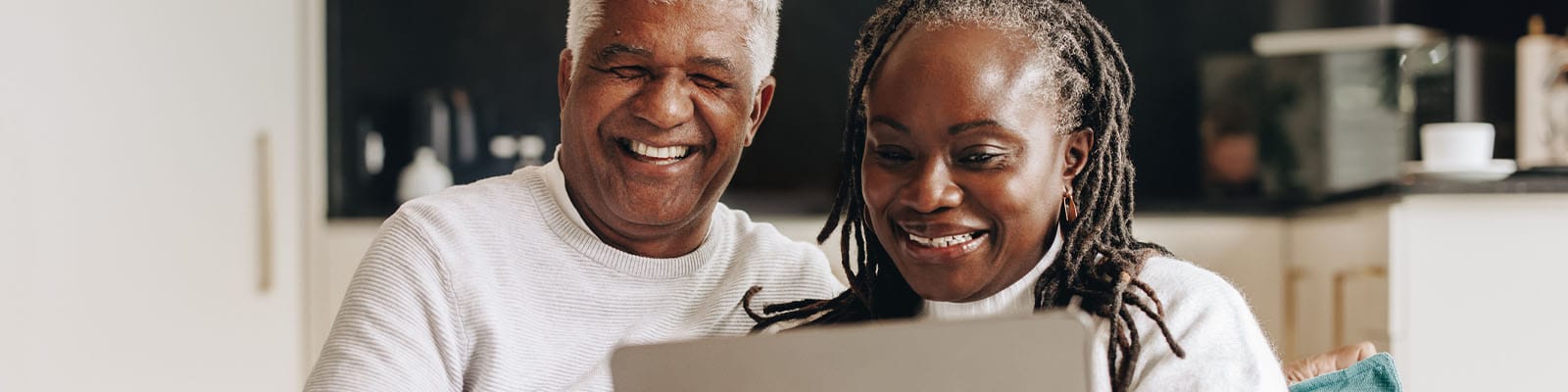 Couple enjoying time together with a laptop in a common area
