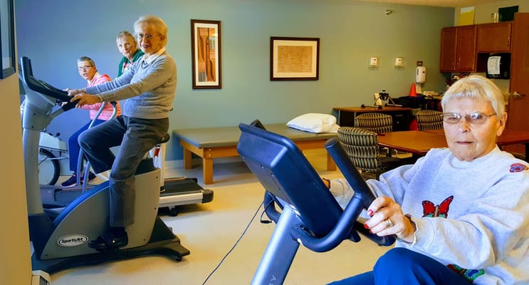 Residents engaging in exercise activities in a common area