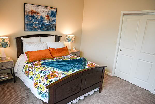 Cozy interior of a resident's room with a bed and decor
