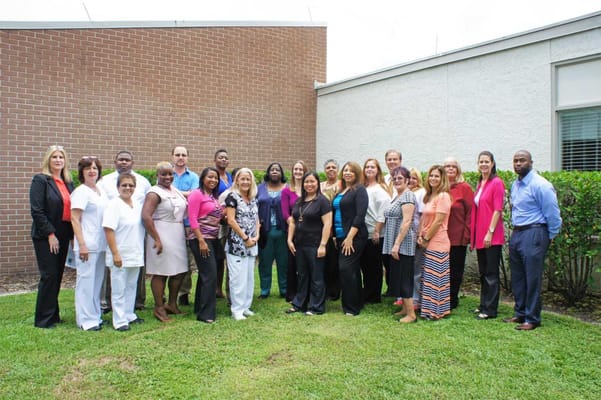 Staff group photo in outdoor space at the facility