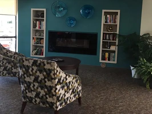 Cozy common area with books and decorative art