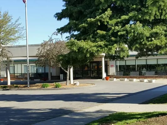 Exterior view of the Medilodge facility with trees