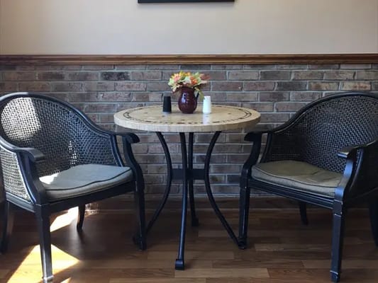 Cozy seating area with floral arrangement