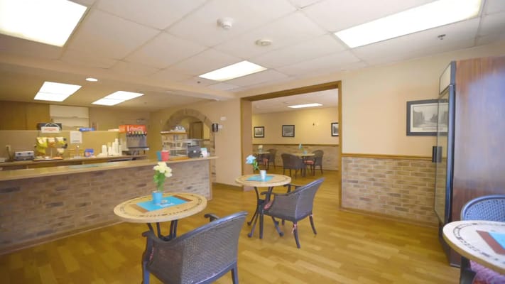 Interior view of a dining area with tables and chairs