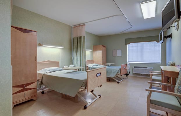 Interior view of a patient room with two beds