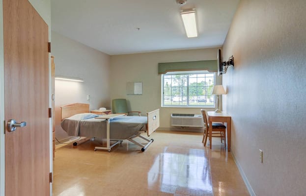 Private resident room with bed and window
