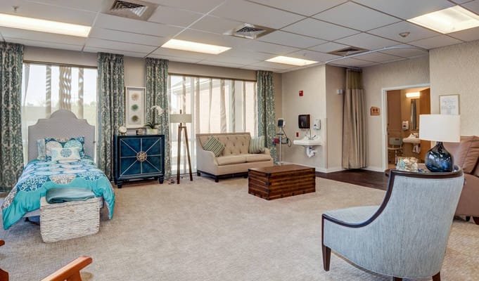 Cozy interior room with a bed and sitting area