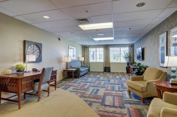 Bright common area with seating and natural light