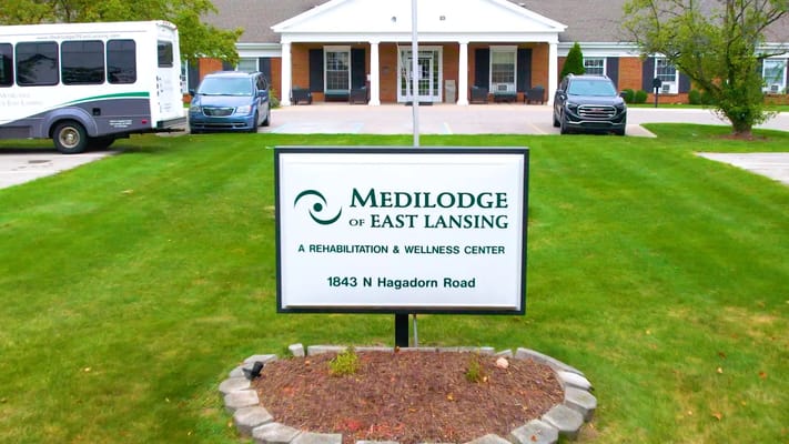 Front entrance of Medilodge of East Lansing with signage