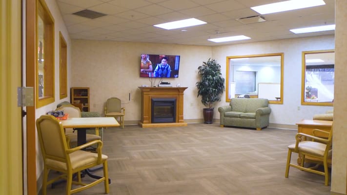 Interior view of a common area with seating and a TV