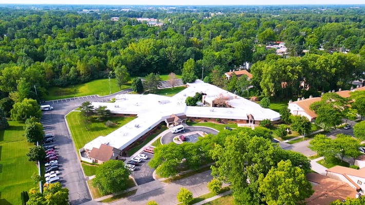 Aerial view of Medilodge of Capital Area surrounded by greenery