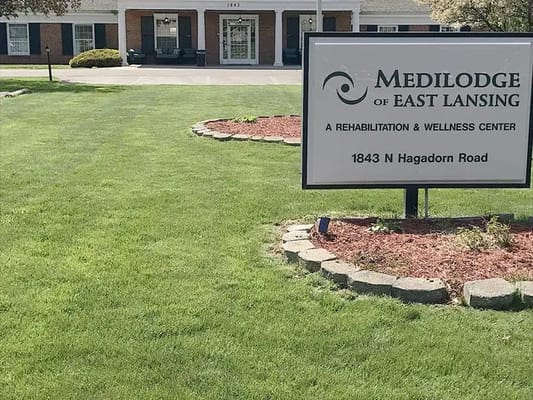 Exterior view of Medilodge of East Lansing with signage