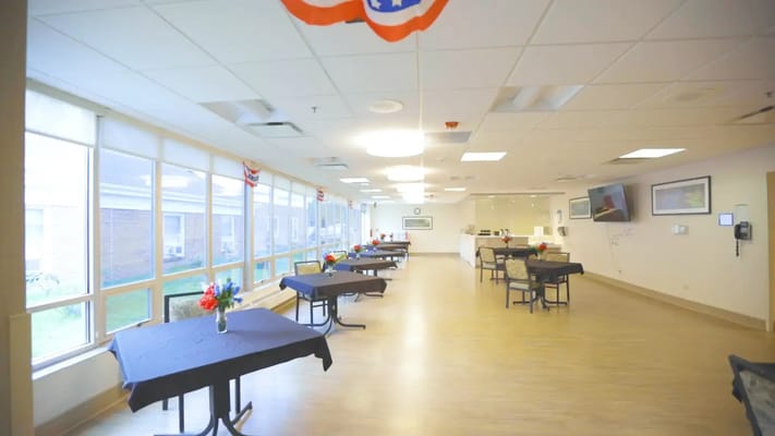 Bright dining area with tables set for an event