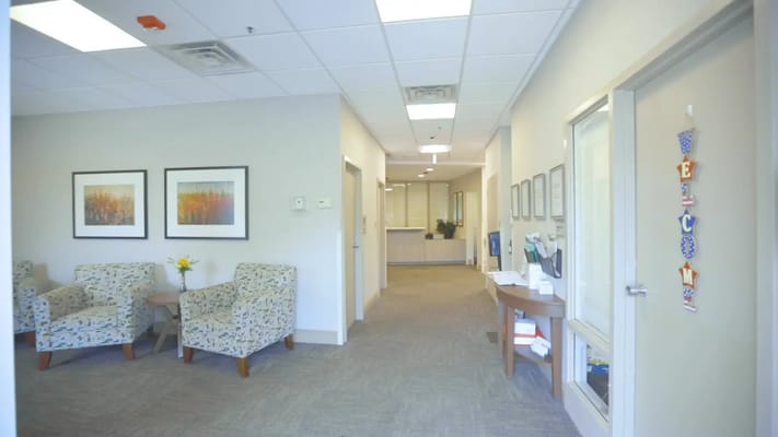 Bright common area with chairs and decor