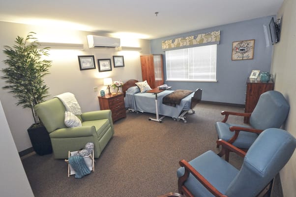 Cozy resident room with two beds and seating area