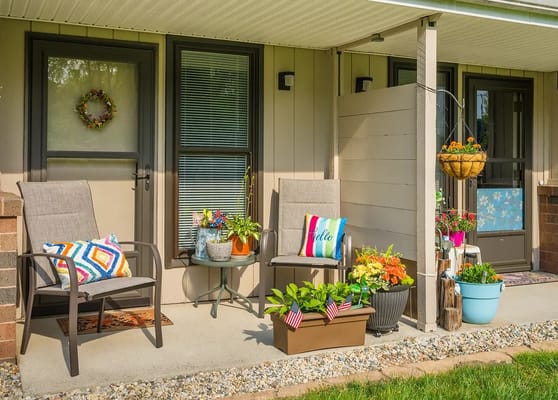 Welcoming outdoor seating area with vibrant flowers