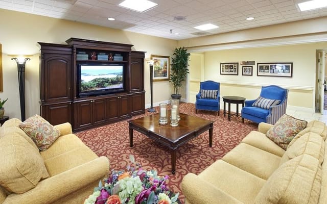Comfortable living room area with seating and television