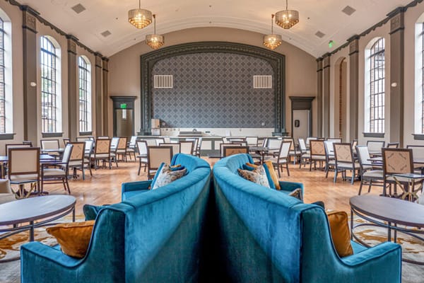 Interior view of a vibrant common area with seating