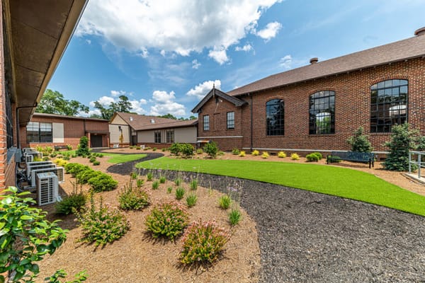 Well-maintained outdoor garden area at a senior living facility