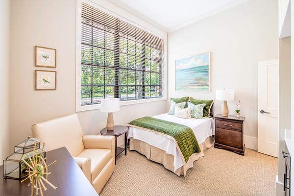 Cozy private room with a bed and seating area