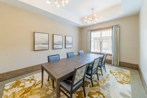 Bright, modern conference room with a large table