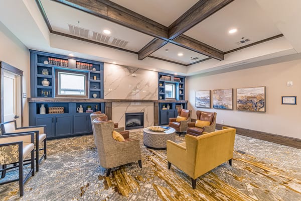Cozy common area with seating and bookshelves