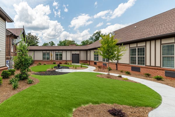 Well-maintained courtyard with landscaping
