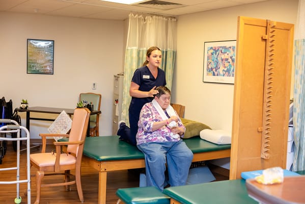 Therapy session in a well-lit activity room
