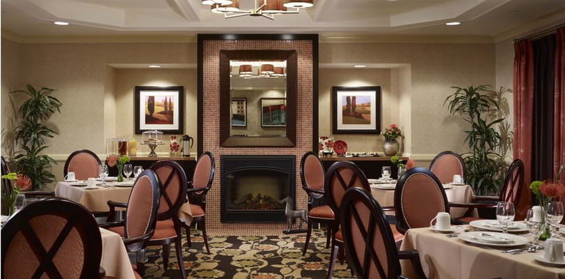 Elegant dining room with tables set for a meal