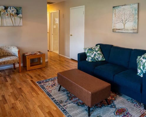 Cozy living room area with sofa and artwork