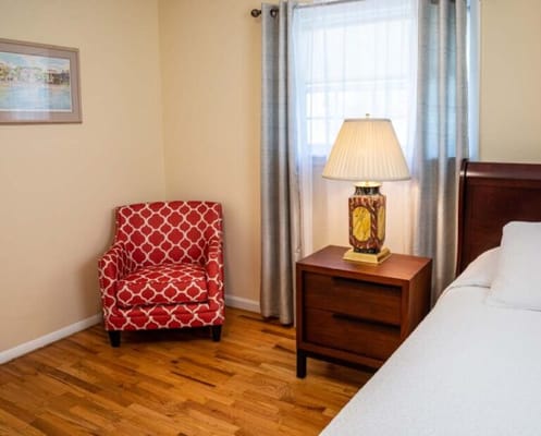 Cozy resident room with chair and lamp