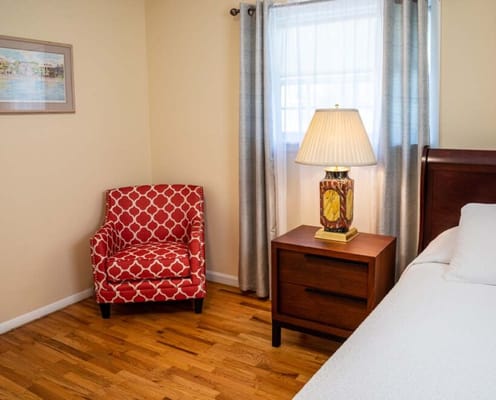 Cozy resident room with chair and lamp