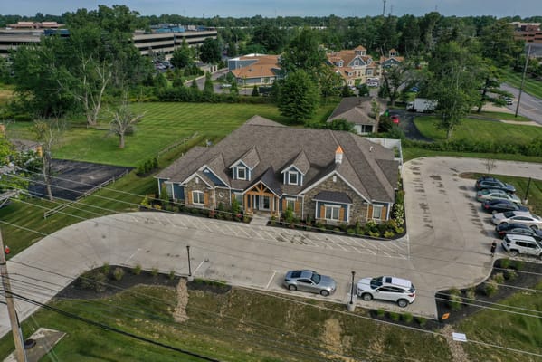Aerial view of a senior living facility with landscaped grounds