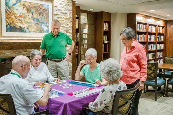 Residents enjoying a game in the library