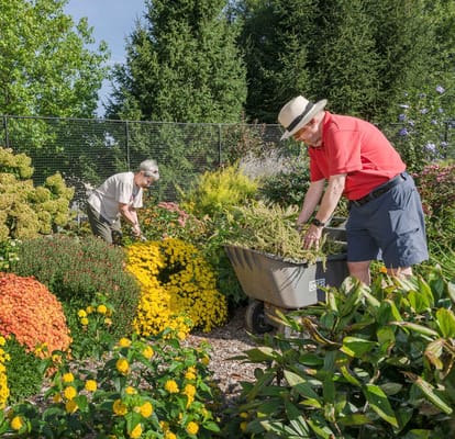 Residents gardening in a vibrant outdoor space