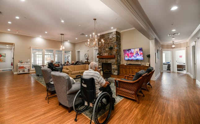 Residents enjoying a common area with comfortable seating