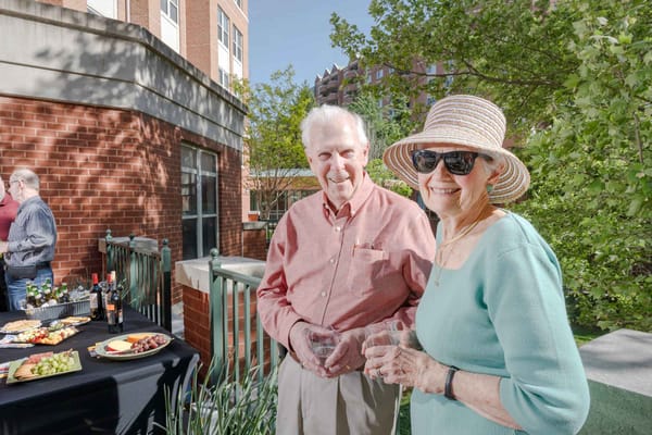 Residents enjoying a celebration on the patio