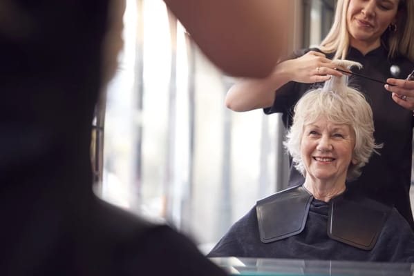 Senior resident enjoying a hair salon service