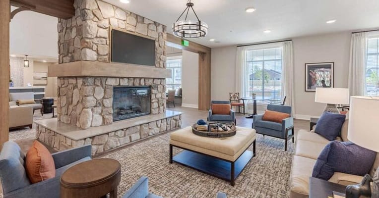 Bright common area with comfortable seating and fireplace